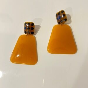 Plastic yellow color earrings with leopard tops. New.